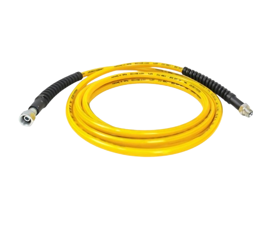 Coiled yellow high-pressure water hose with metal fittings
